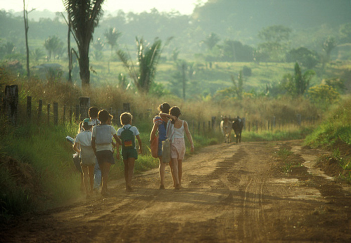 Kids walking home in a rural area